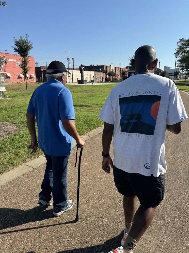Community engagement activity during an outdoor workshop for mission-driven organizations in Las Vegas – participants walking together in a park setting