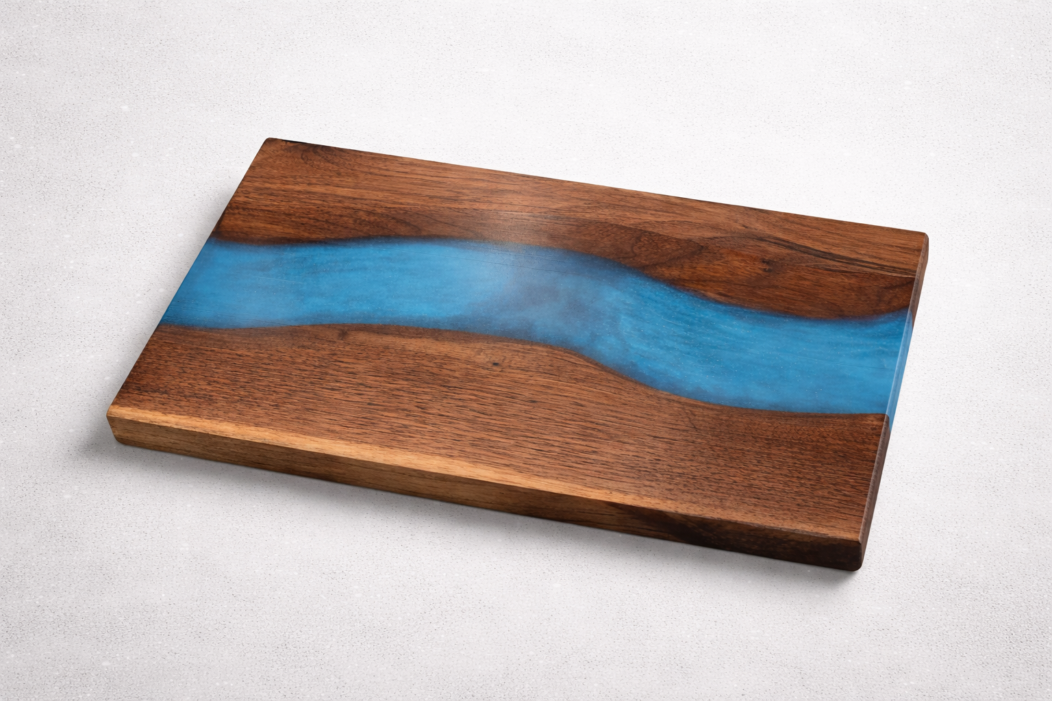 Wooden serving tray with a blue resin river design.