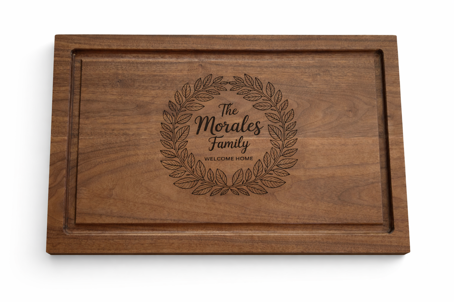 Wooden family plaque with a leaf wreath design and the text 'The Morales Family Welcome Home' engraved in the center.