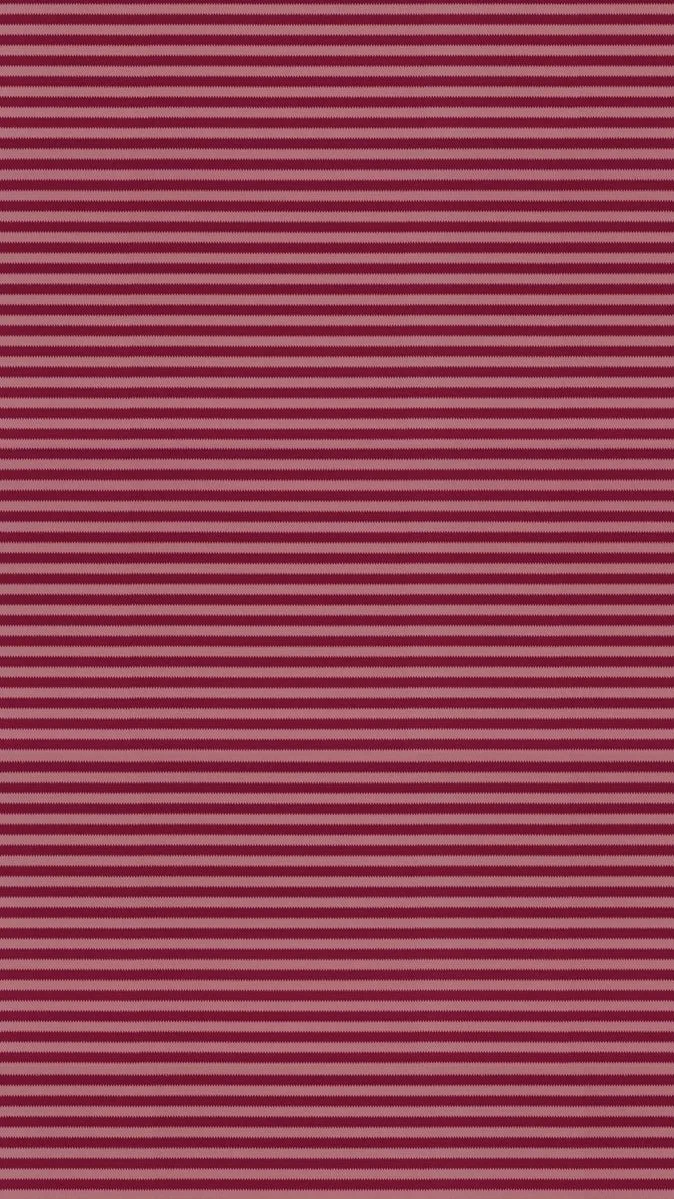 Close-up of a fabric with alternating pink and dark maroon horizontal stripes.
