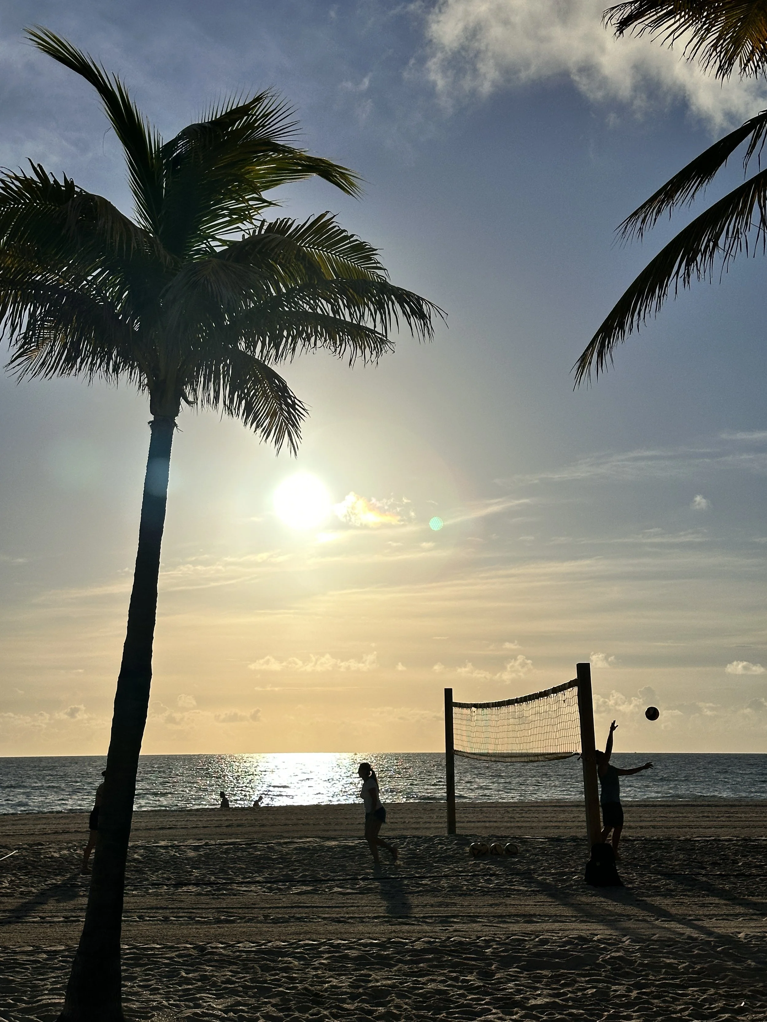 Beach volleyball at sunset in Palm Beach, Florida