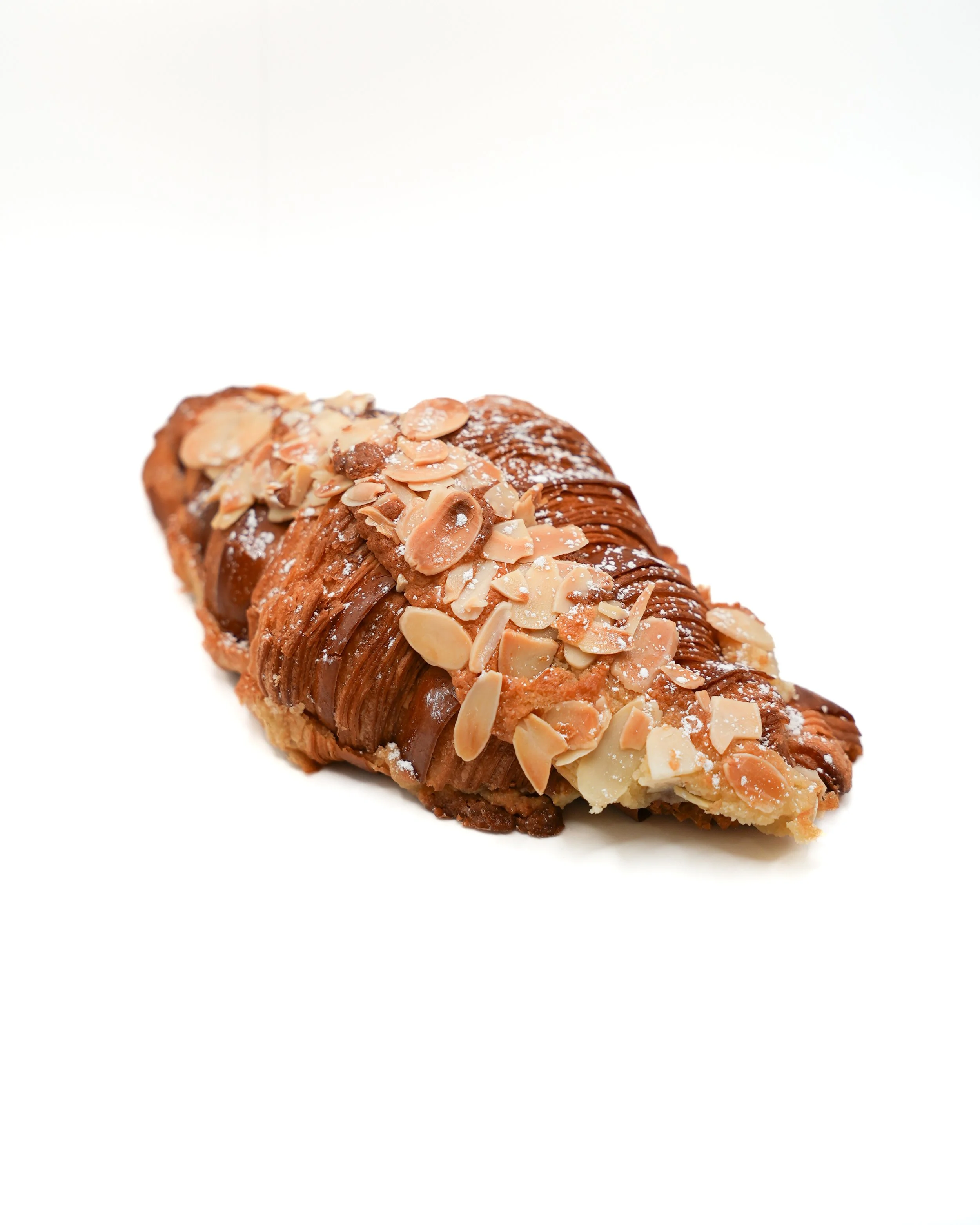 Almond Croissant Honey Cup Coffeehouse Golden, flaky layers filled with rich almond cream and jammy berry compote