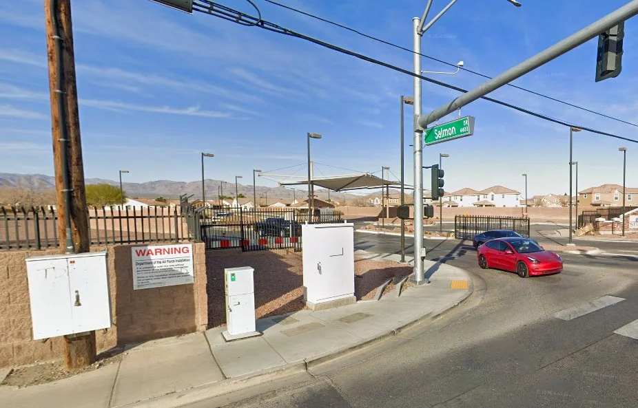 Street sign reading “Salmon Dr” at an entrance road near Nellis Air Force Base in Nevada, named for Thunderbird pilot Capt. Charles “Chuck” Salmon.