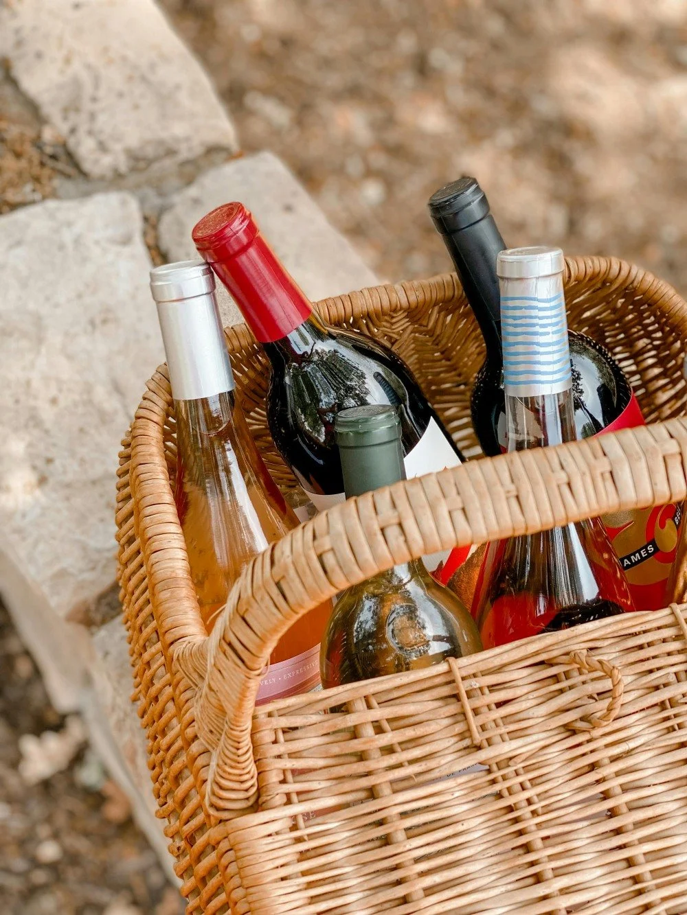 wine bottles in wicker basket