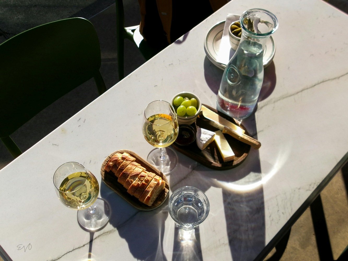 marble table with wine and cheese