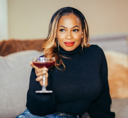 Founder Mo Eddleton with a cocktail