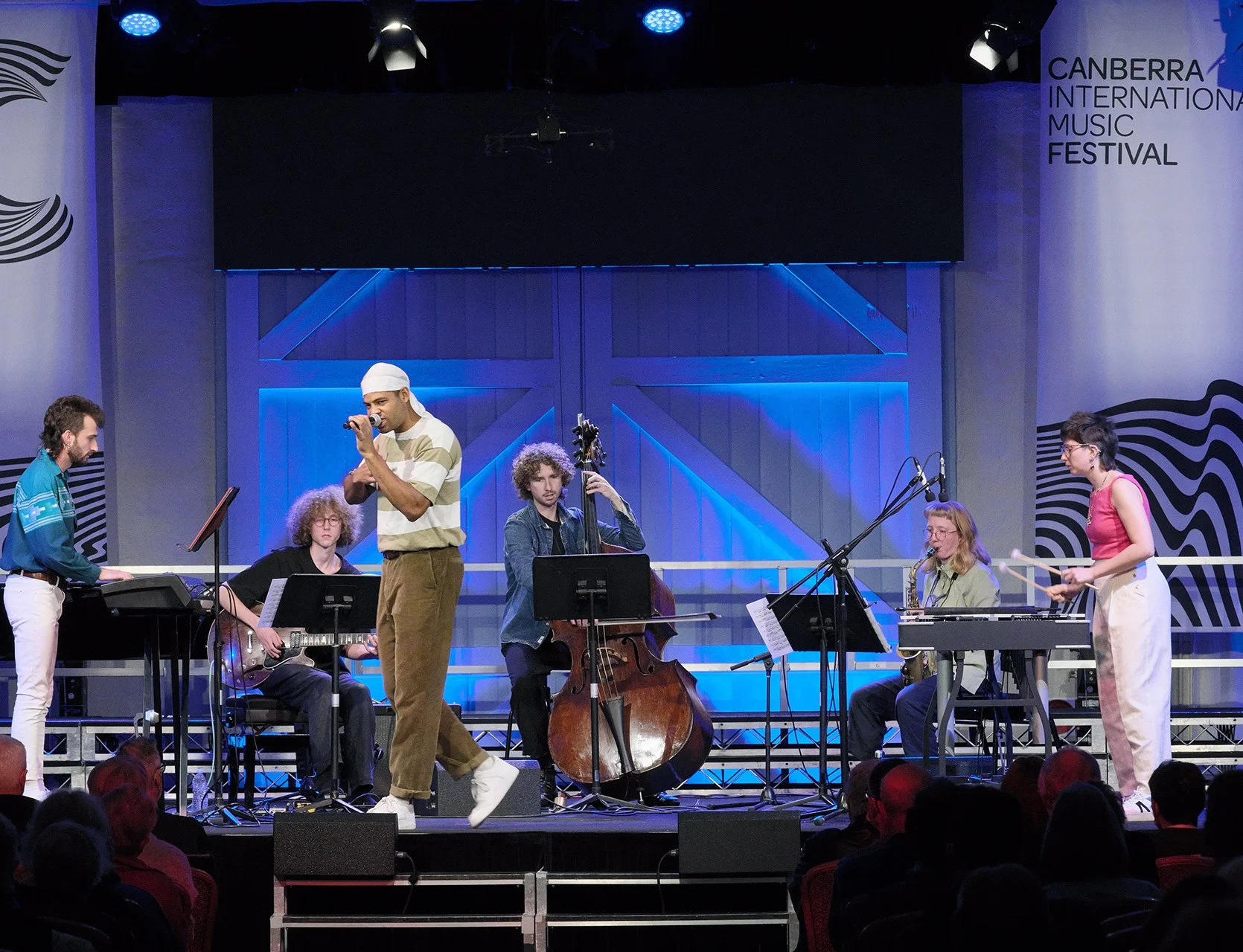 6 instrumentalists performing on stage
