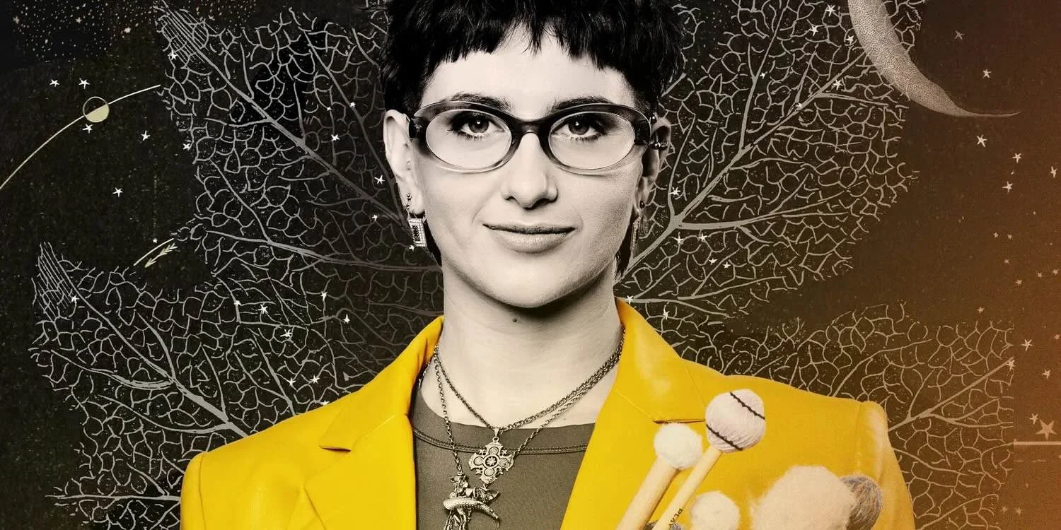 Black and white image of woman wearing yellow jacket with