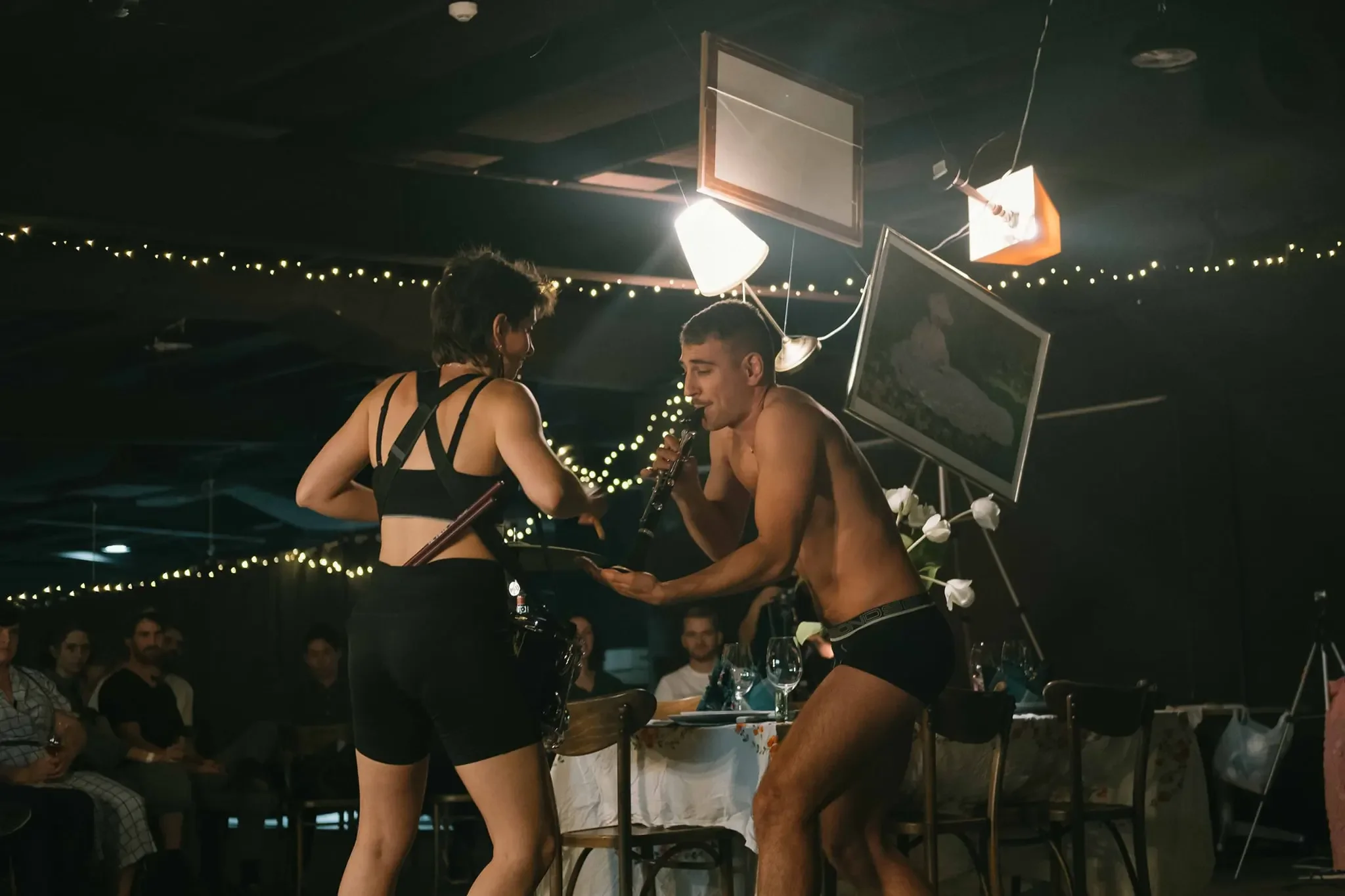 Two people dynamically engaged in a performance