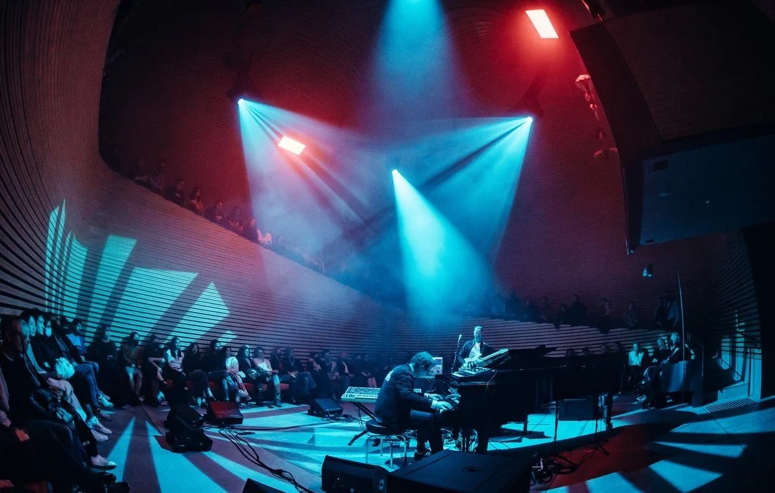 Modern performance space with audience and lights