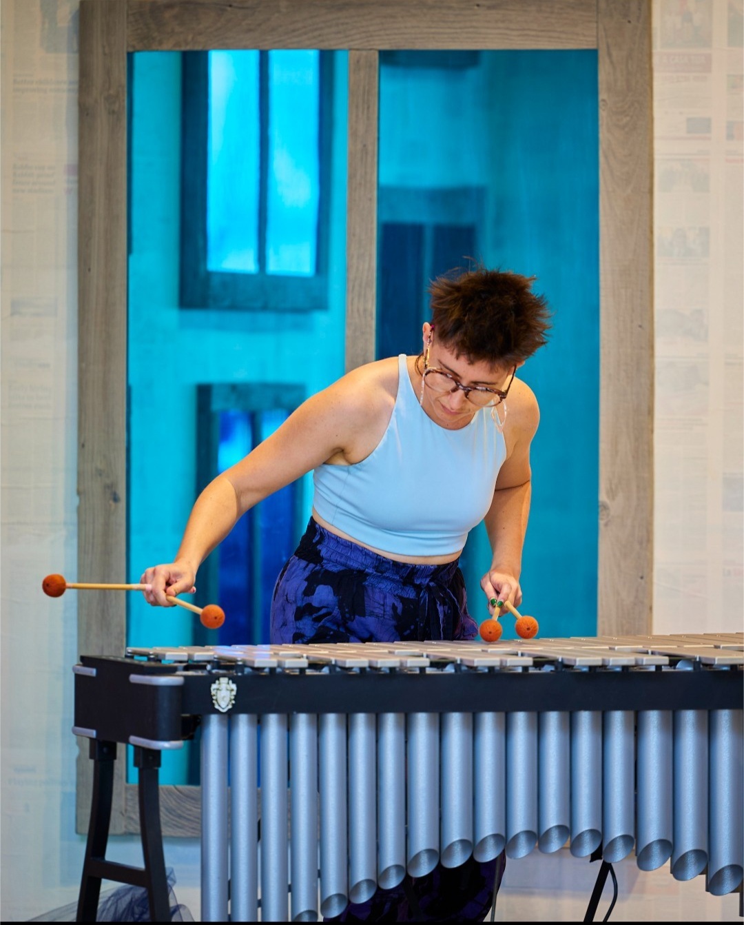 Woman playing vibraphone outside