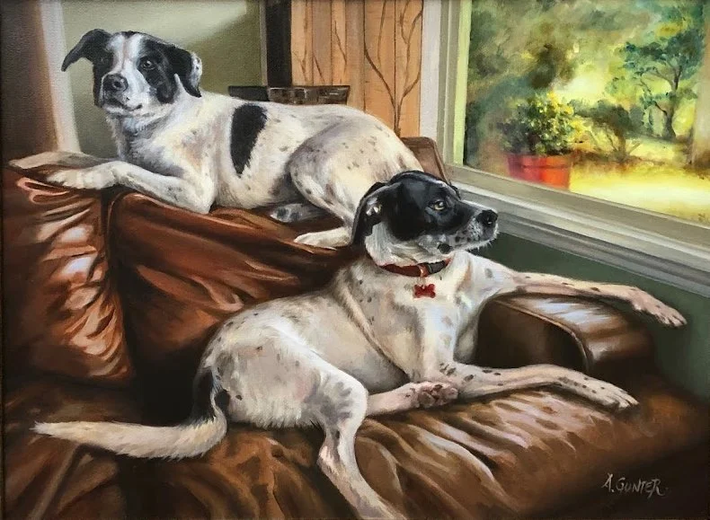 Two black and white mixed breed, medium sized dogs resting on a leather couch next to a window showing an outdoor garden with trees and a potted plant. A pet Portrait commission oil painting.