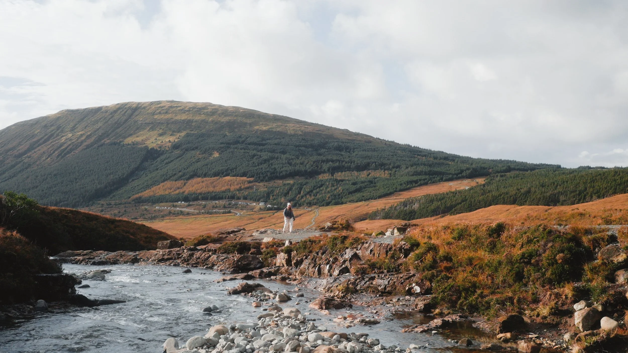  This shot contrasts with the previous shot . Here, the neurodiverse character is walking along a winding gravel path, visually conveying how the neurodiverse path, whilst not the most common path to walk, is unpredictable and interesting to follow, 