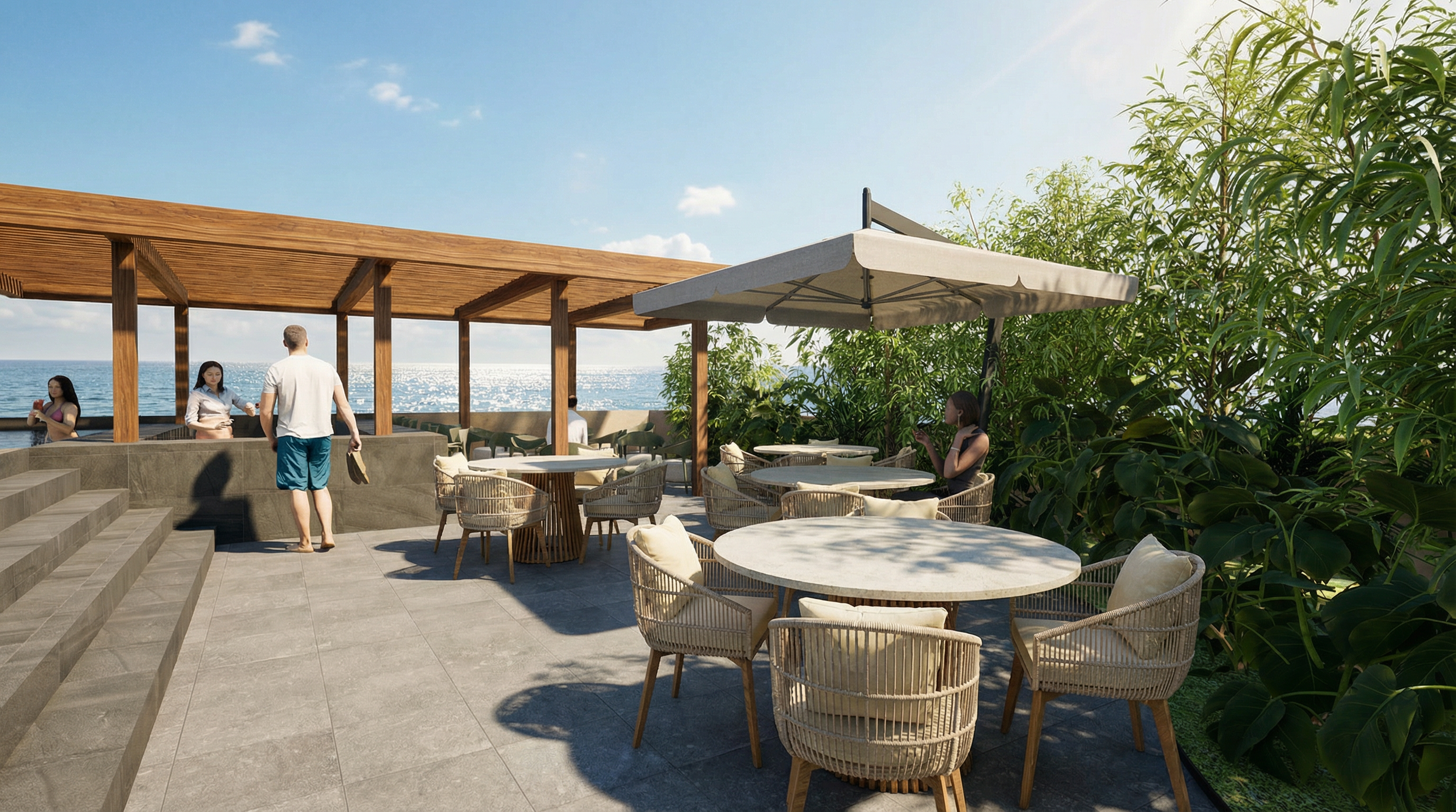 Outdoor terrace with seating area, umbrellas, and view of the ocean, with people relaxing and socializing.