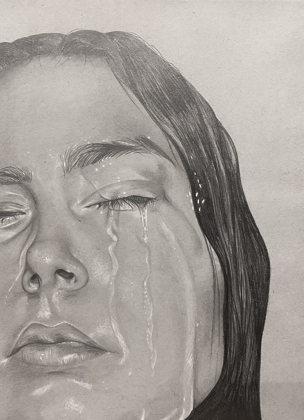 A detailed black-and-white drawing of a woman with water streaming down her face, eyes closed, and dark,wet hair.