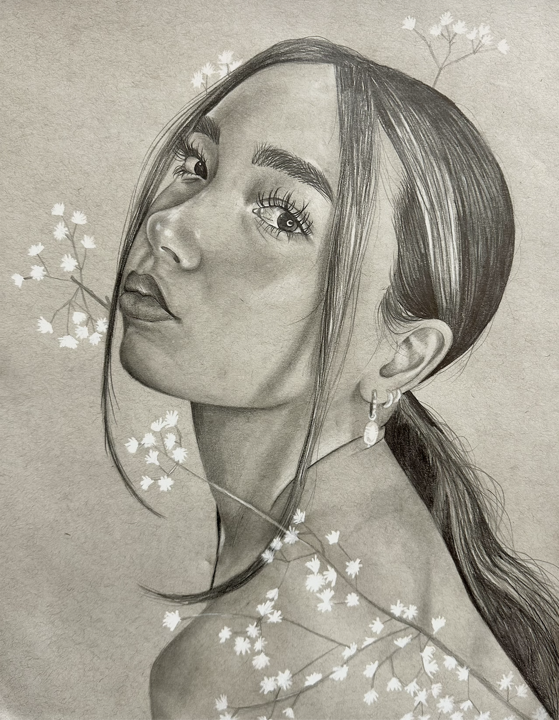 A detailed graphite sketch of a woman's face with long hair, large expressive eyes, earrings, and a flower-themed background.