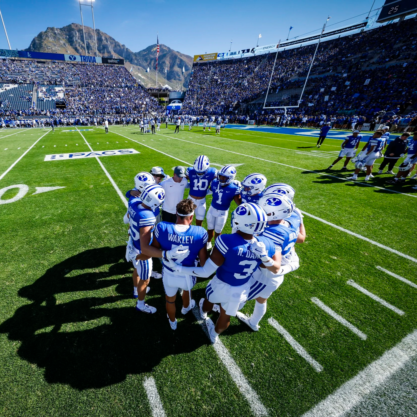 Letter beads spelling out 'Together is the way' on a black textured background.