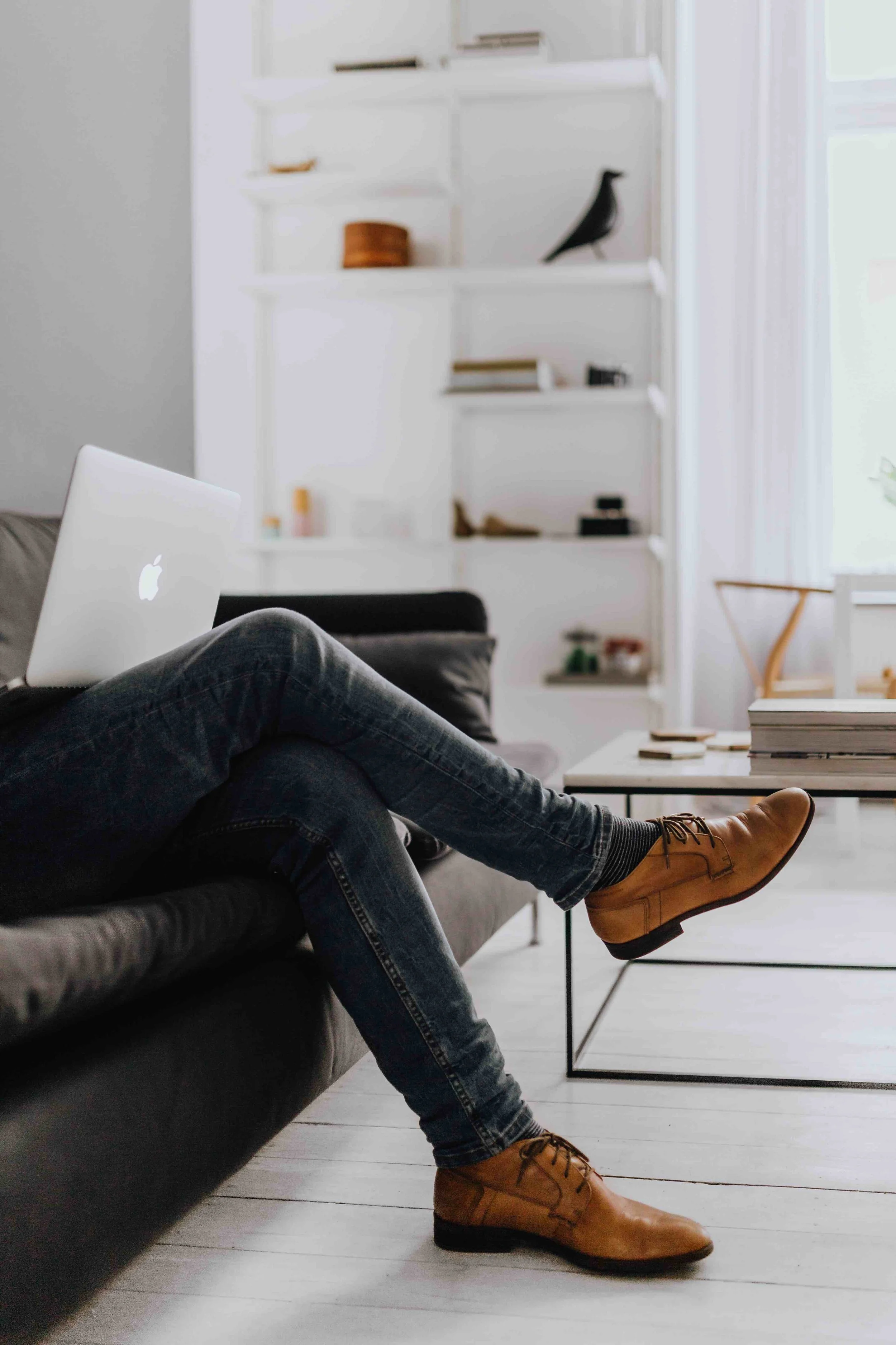 Man using laptop on couch