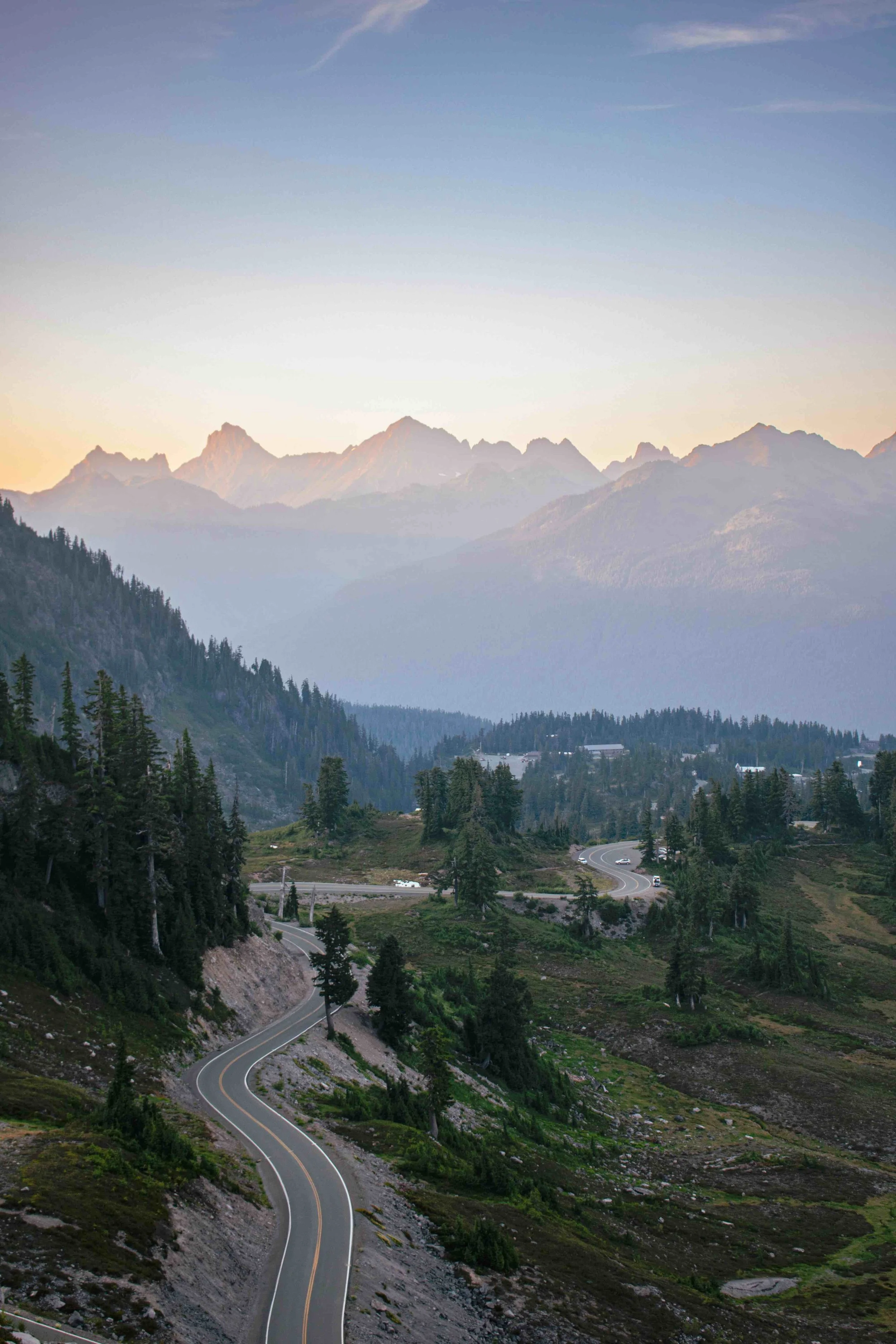 Winding road by forest and mountains in Washington State