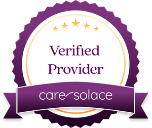 A badge with a purple ribbon that reads 'care*solace' and the words 'Verified Provider' above it, surrounded by a gold border and stars.