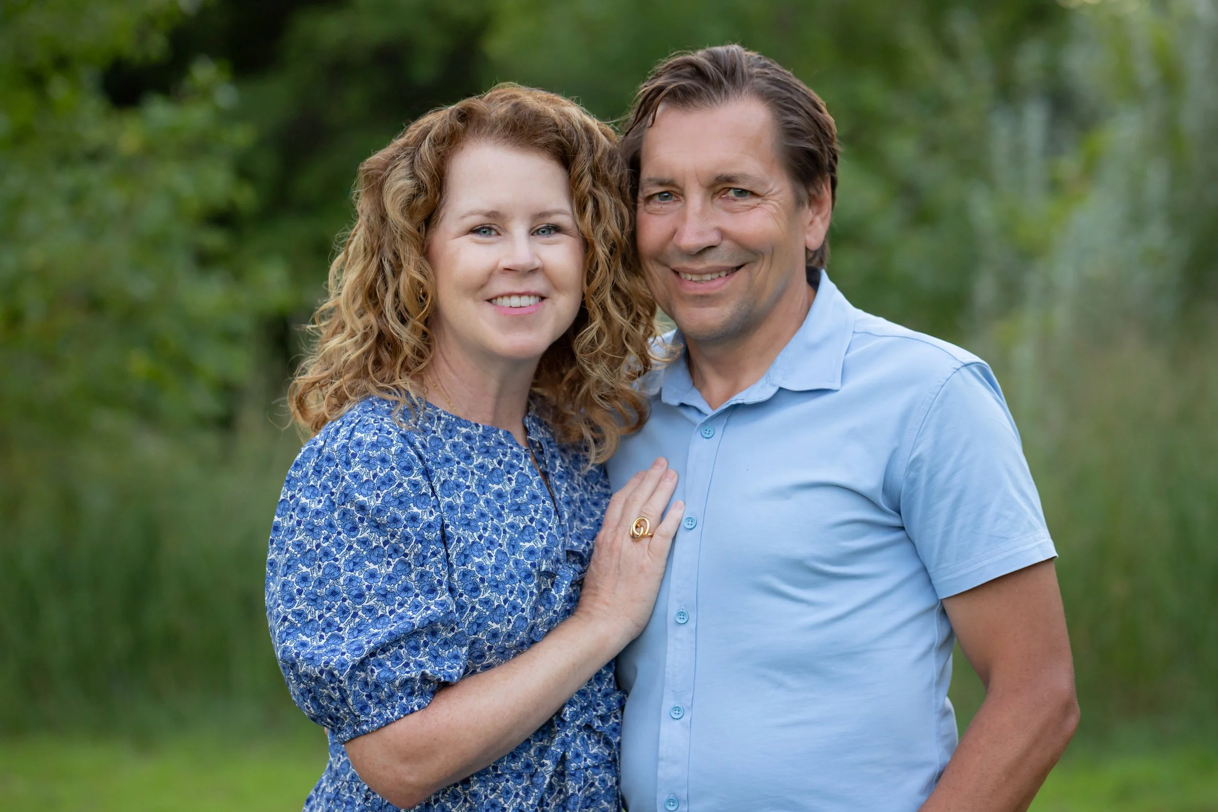 Outdoor photo capture of Chris Kartschoke and his significant other in a relaxed setting.