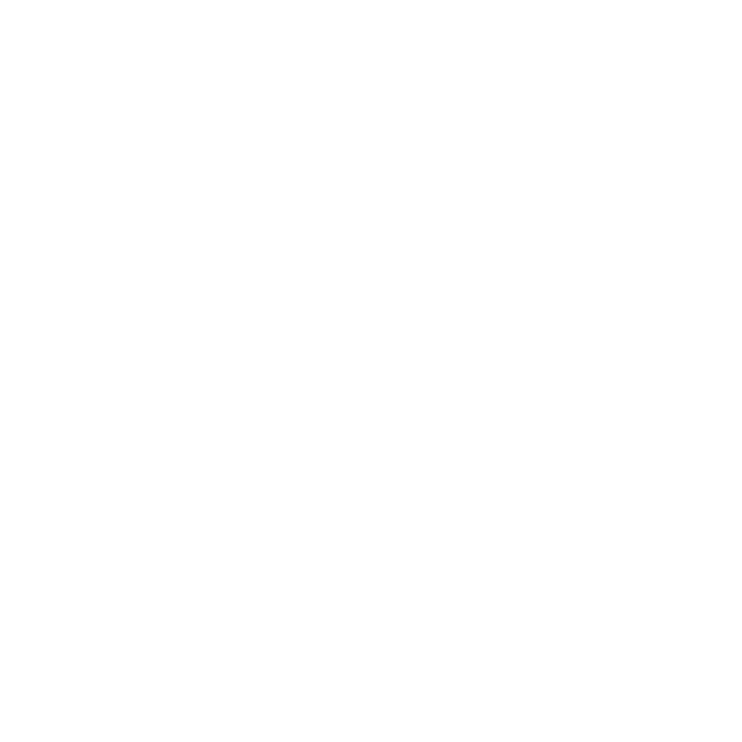 A hand inserting a ballot paper into a ballot box.