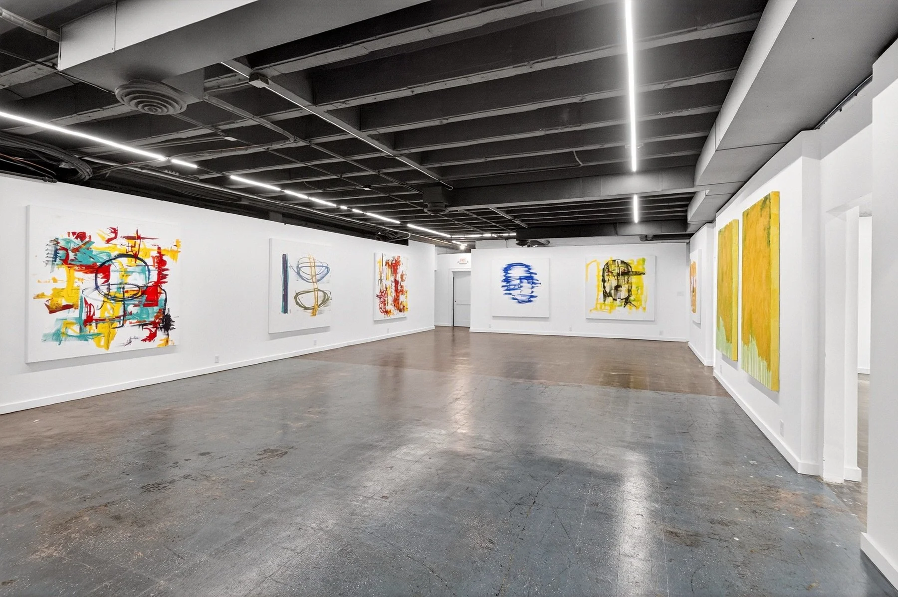 Sanctuary 4580 gallery view with ceiling lights and Nabil Mousa artworks