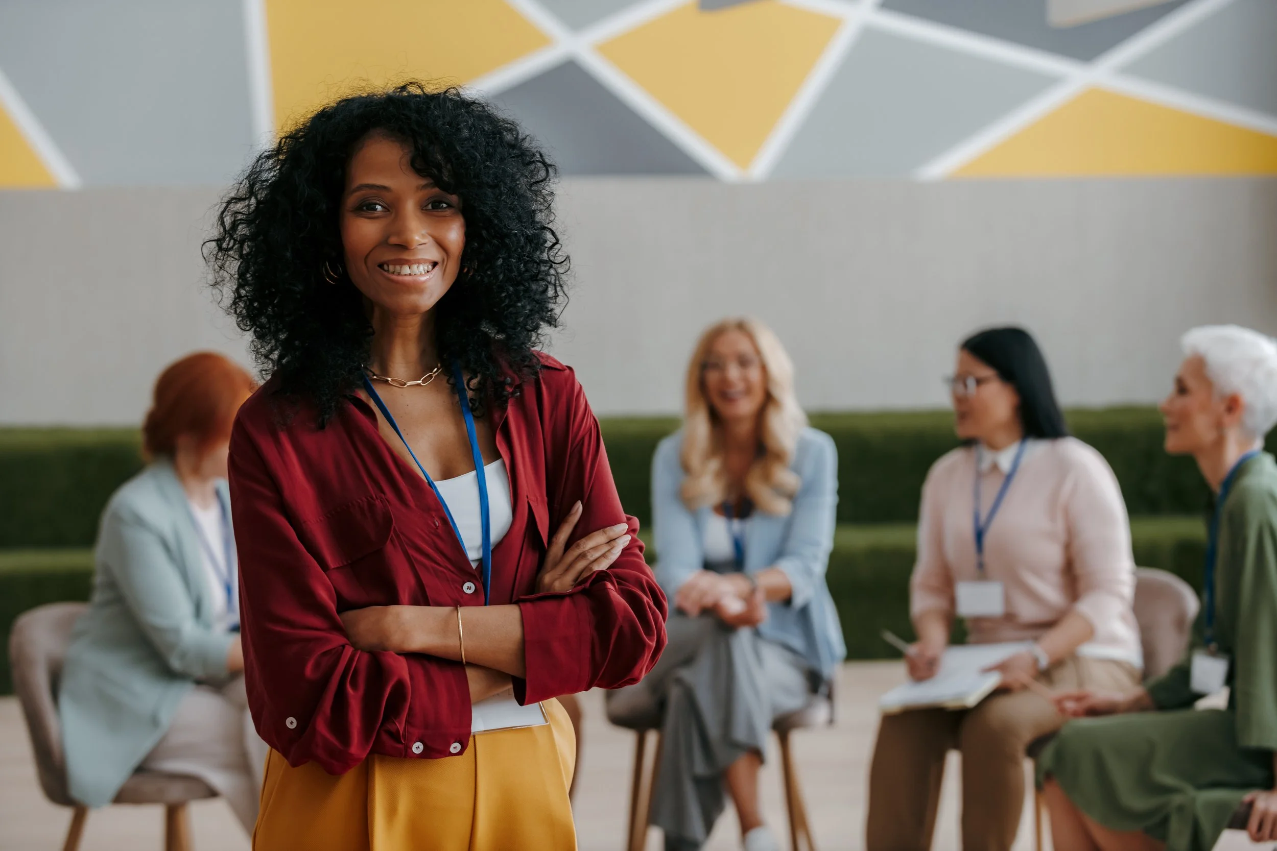 A woman being filmed in a studio with a camera pointed at her