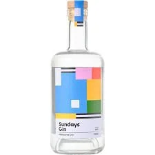 A clear glass bottle of Sundays Gin with a colorful geometric label.
