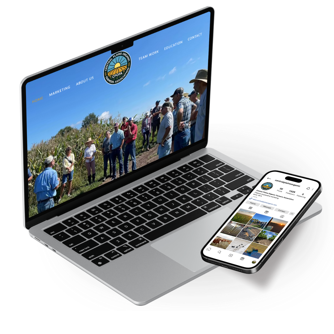 A silver laptop with a black keyboard displaying a website for the Central Plains Organic Farmers Association, showing a group of people standing in a field, and a smartphone resting on the laptop's right side displaying Instagram photos of farms and outdoor scenes.