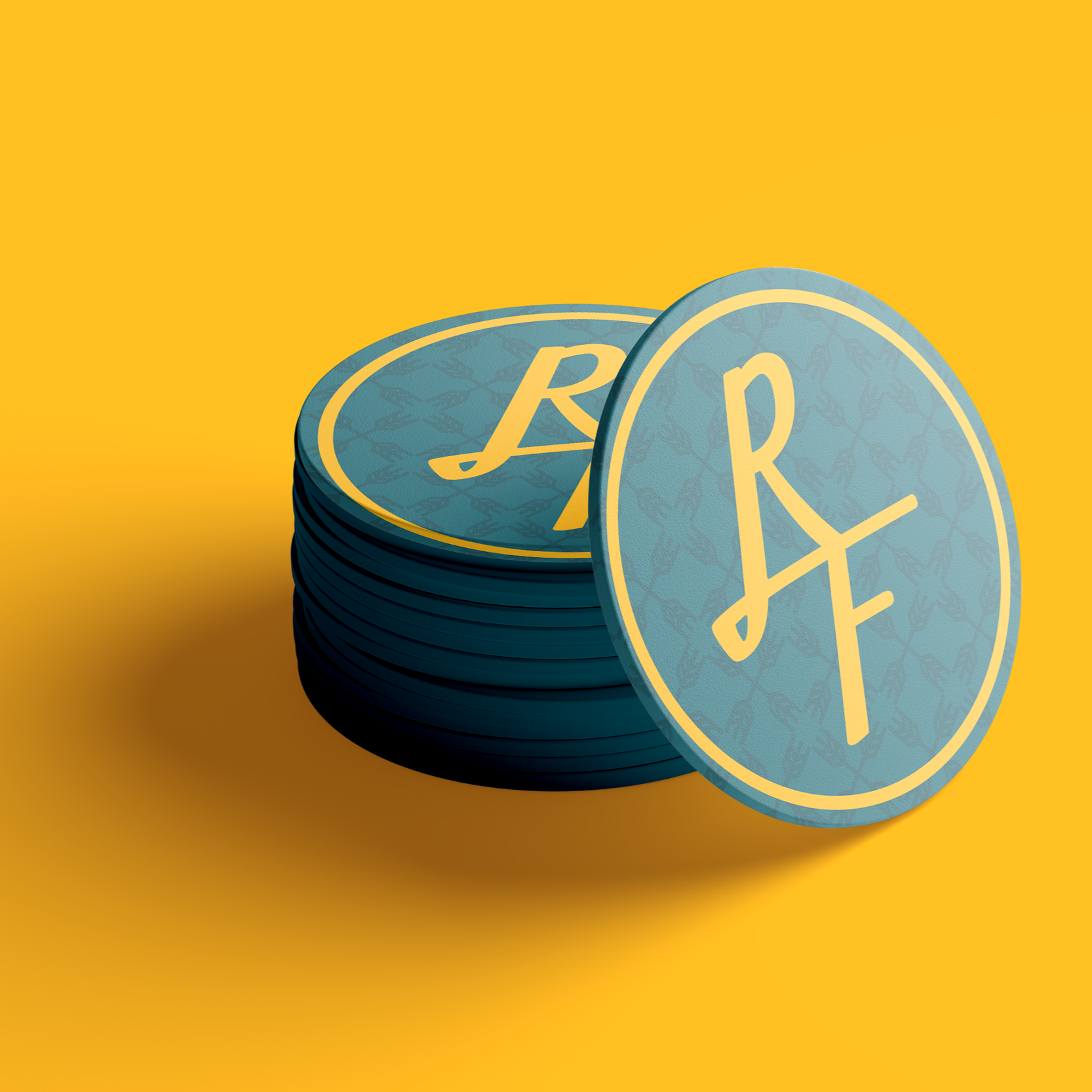 Stack of blue tokens with yellow initials "R A F" on a yellow background.