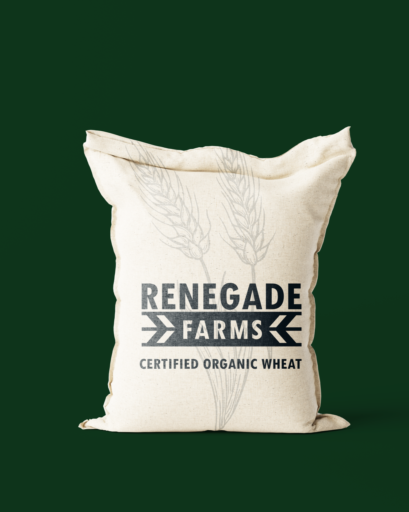 Bag of Renegade Farms certified organic wheat with wheat illustration on off-white fabric.