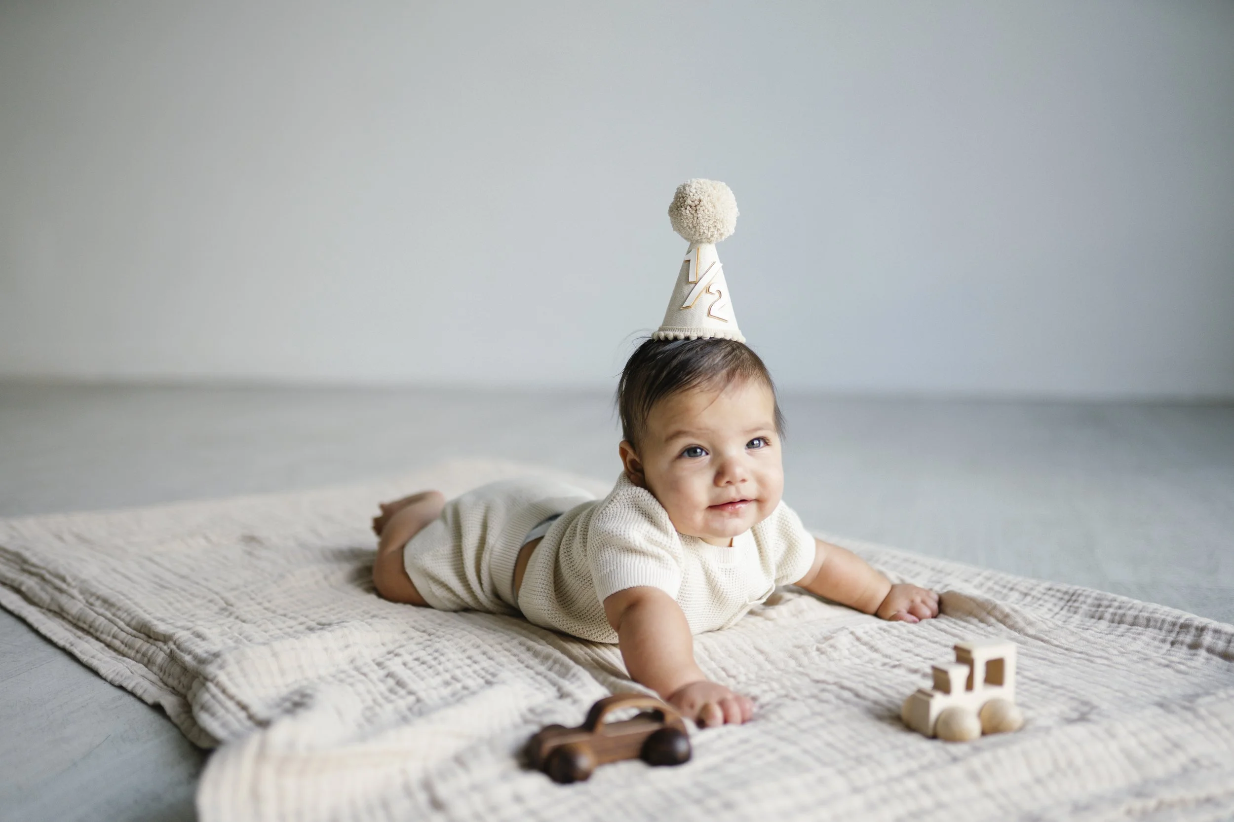 6 month milestone session baby boy party hat 1/2 birthday crawl sit up