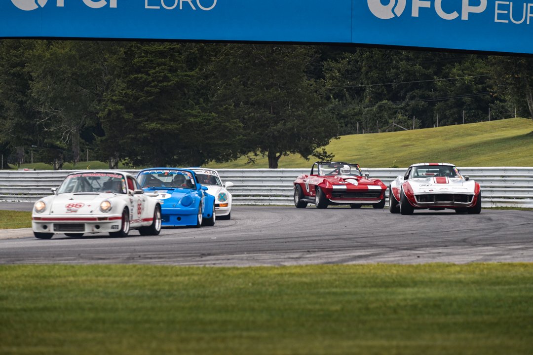 Porsch to the Left Vettes to the Right in Turn 1_.jpg