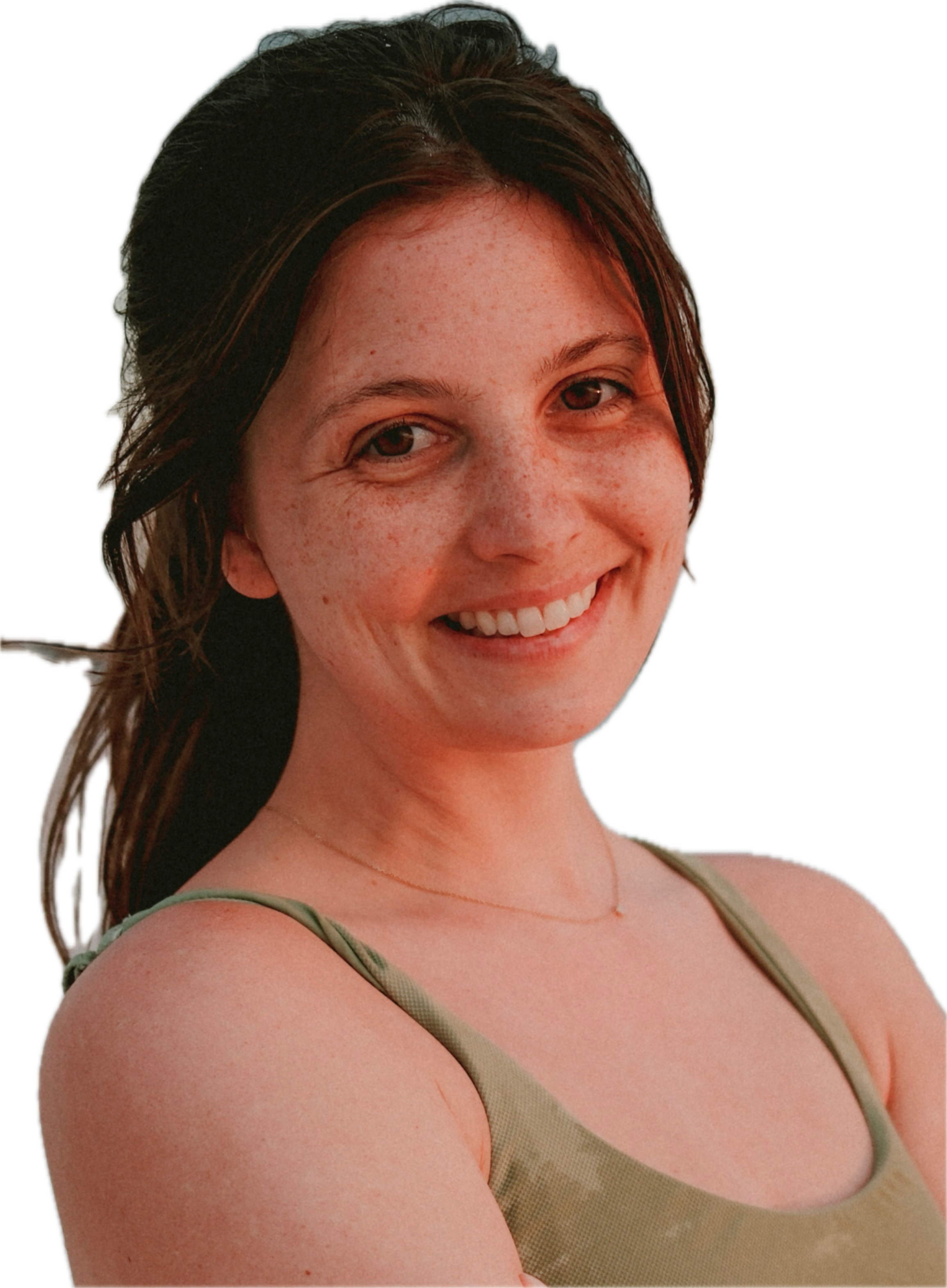 Close-up of a woman with auburn hair, smiling, wearing a light green tank top. The background is identified as transparent.