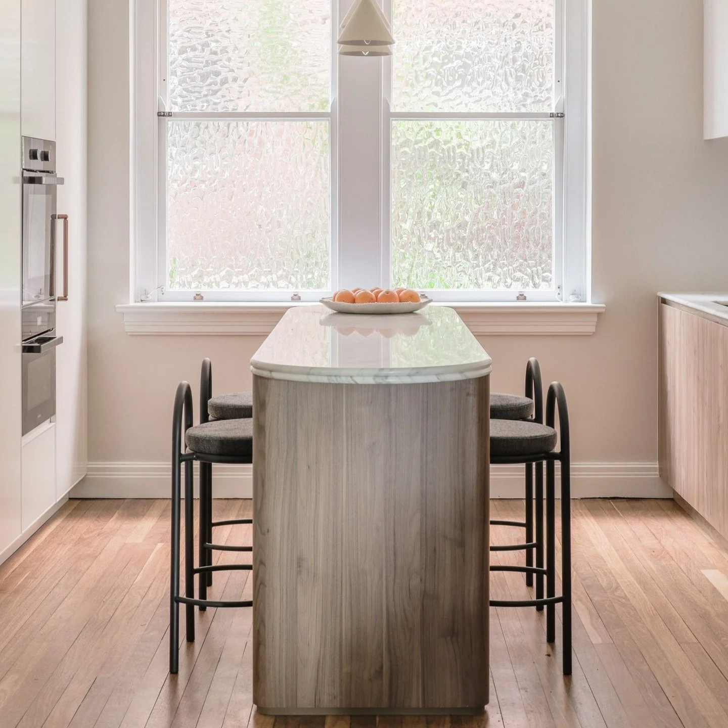 A personal renovation project in Woollahra focused on refining a dated layout, including relocating the kitchen to a more central position within the apartment.

The material palette was deliberately paired back &mdash; walnut timber, soft neutrals a