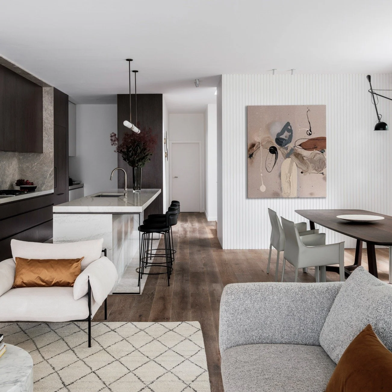 PROJECT II Bishops Alts &amp; Adds

This Randwick living room was designed for how it feels &mdash;
using warm browns, whites and greys to create calm, not trend.

Good design should feel easy to live with.