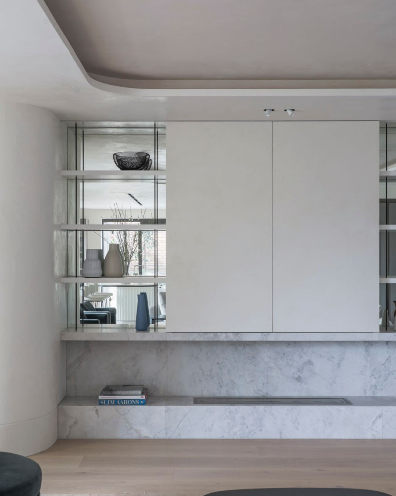 One of my favourite corners from the Macleay St project.
 
The mirrored shelving backs do a lot of heavy lifting here &mdash; makes the space feel twice as big.
 
📷 @danielgullan