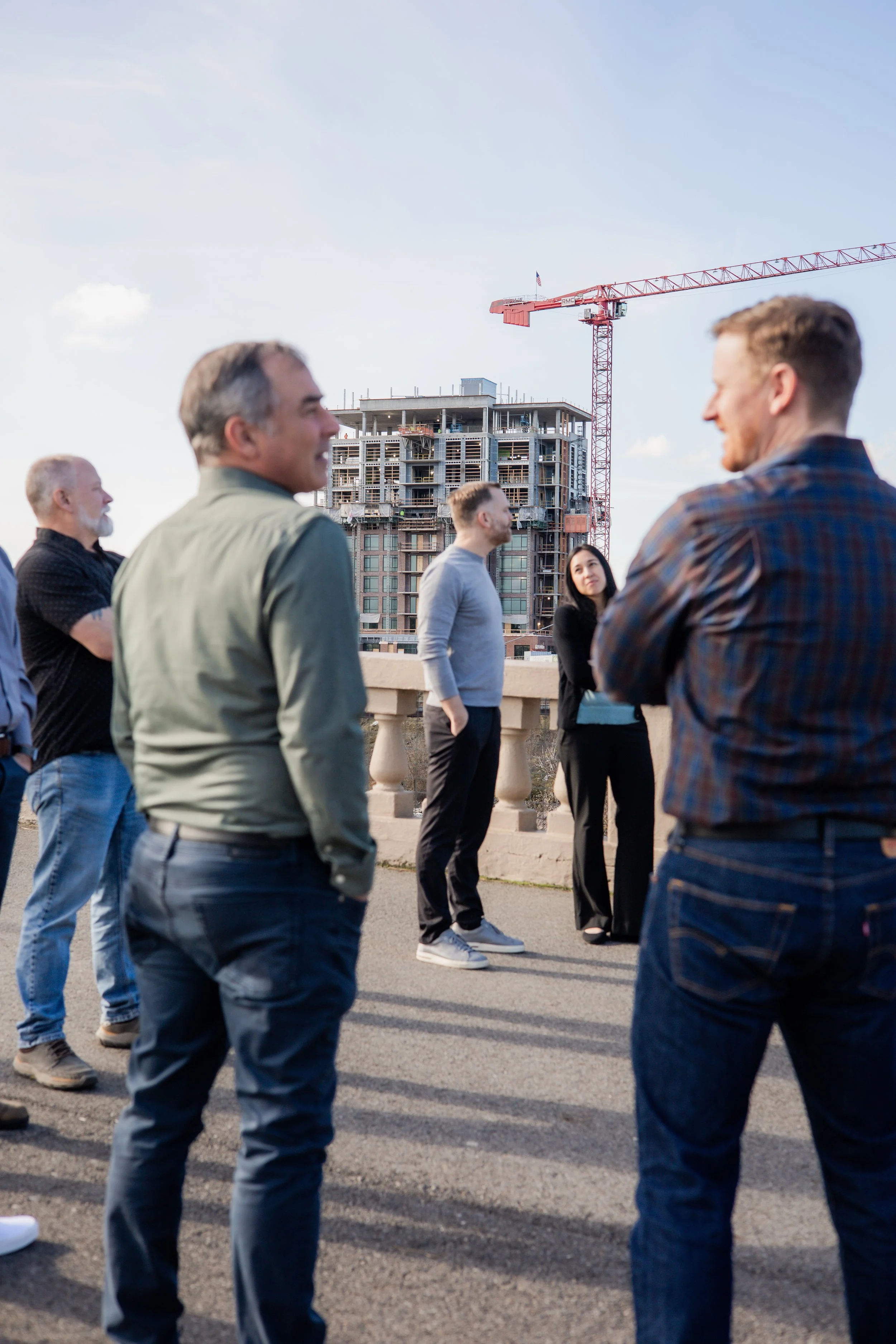 Civil engineers at Varela Engineering & Management gathered outdoors a near job site.