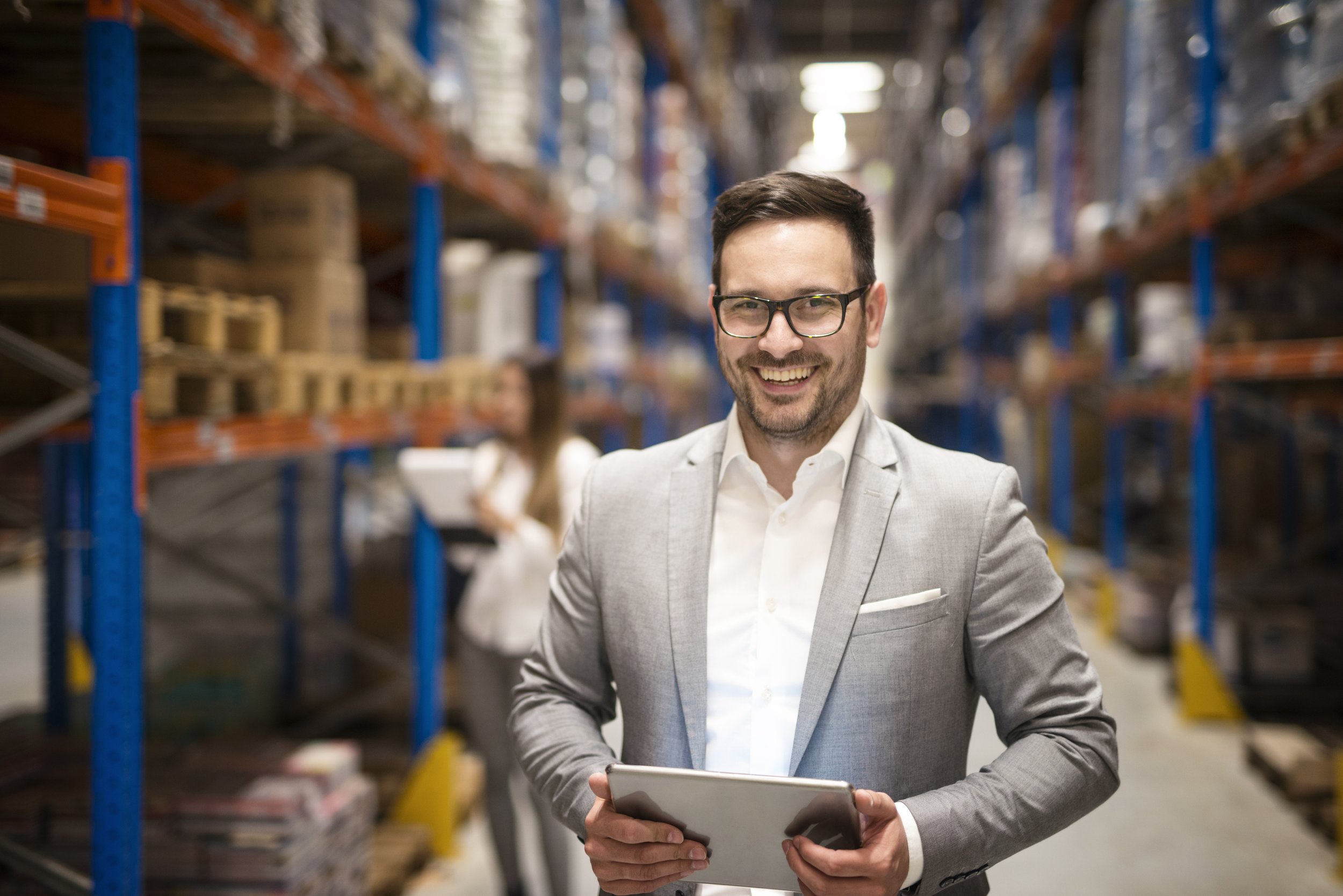 portrait-successful-middle-aged-manager-businessman-holding-tablet-computer-large-warehouse-organizing-distribution.jpg
