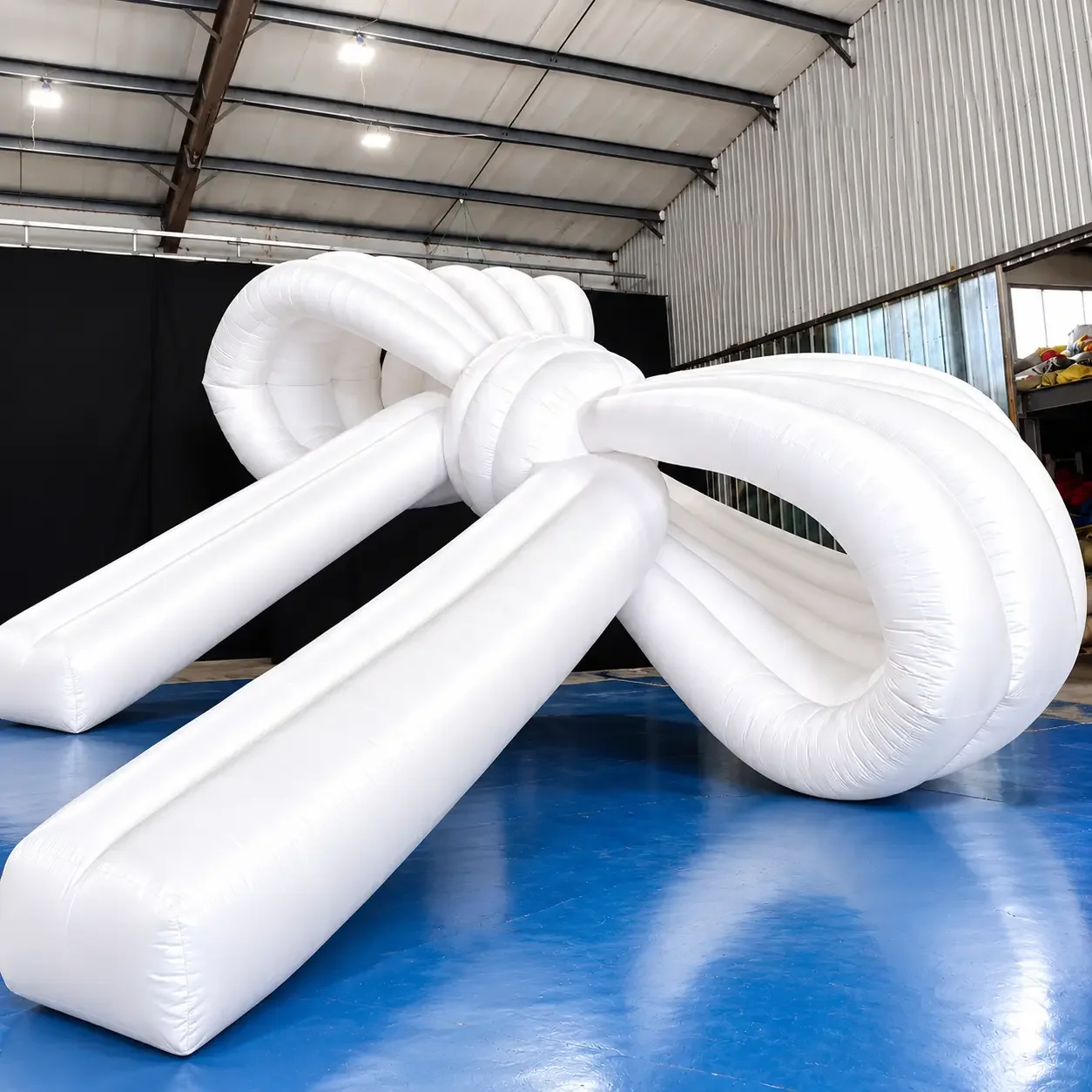 Giant White Inflatable Bow in Workshop.webp