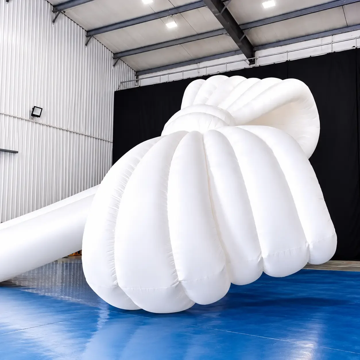 Giant White Inflatable Knot in Warehouse Studio.webp