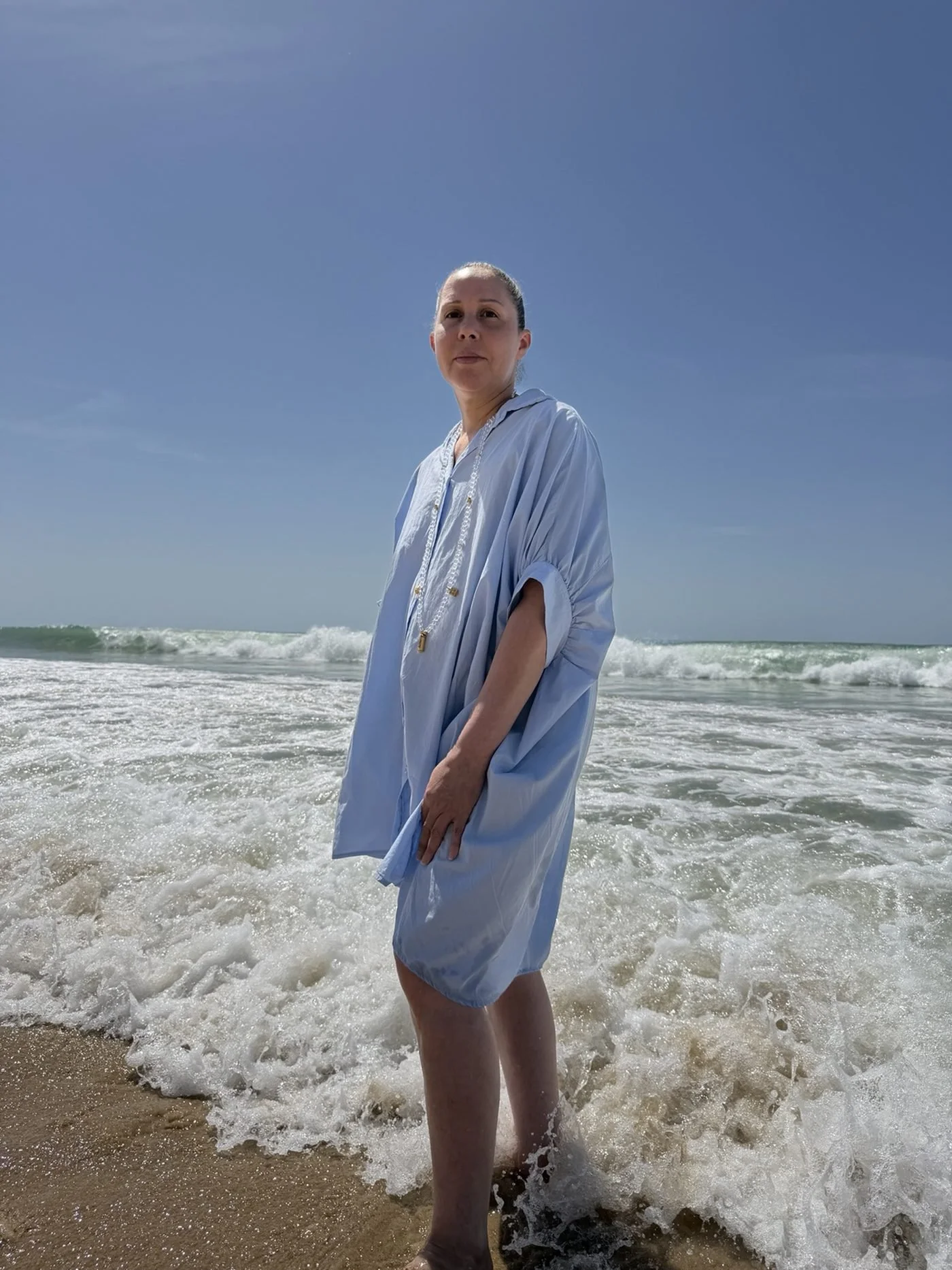 Nadège Rose on the shoreline, founder of The Loop and creator of The Loop method.