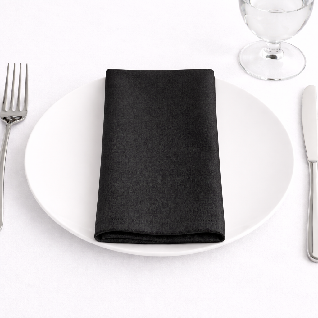 Black napkin on white plate.png