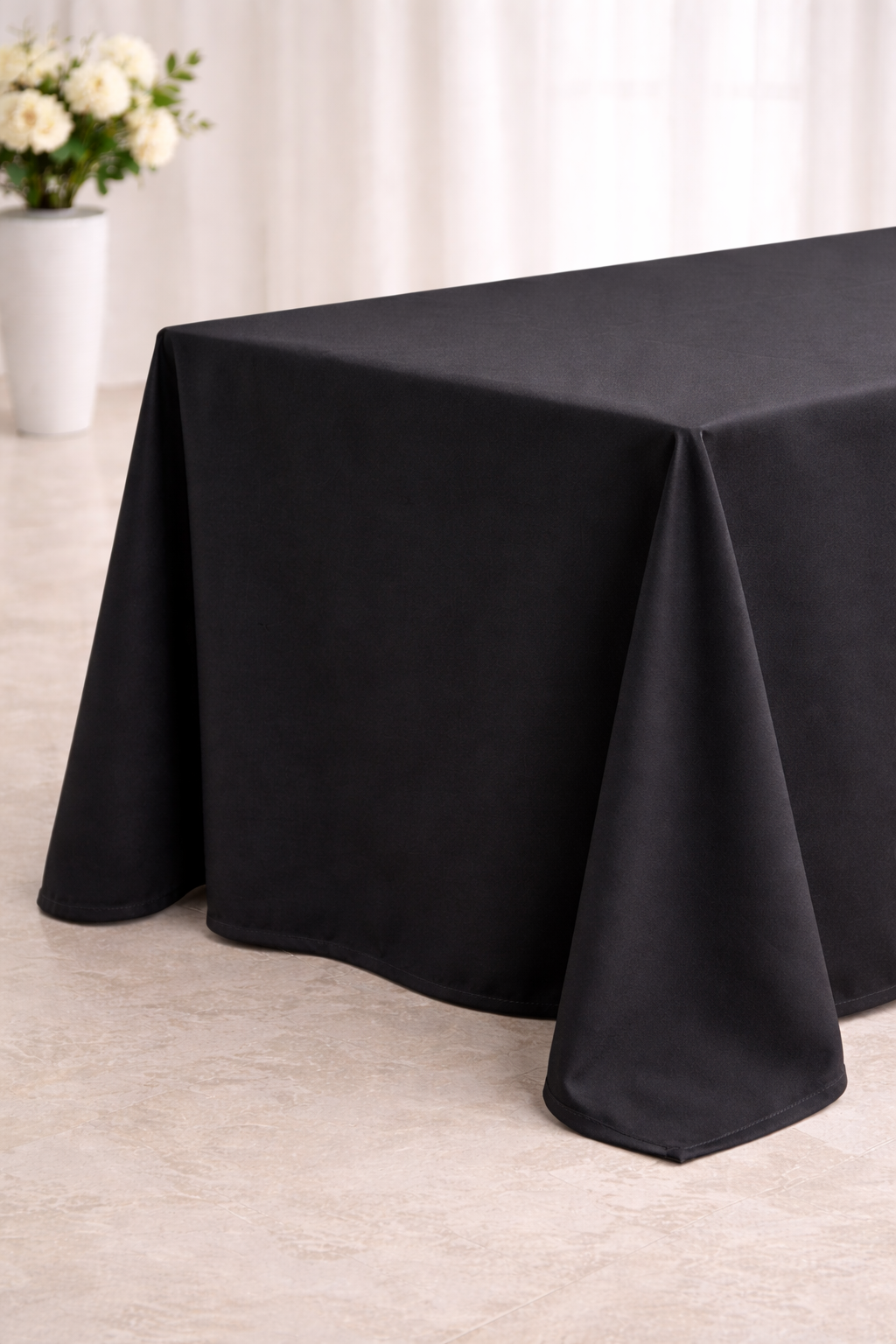 Elegant corner of a draped table.png