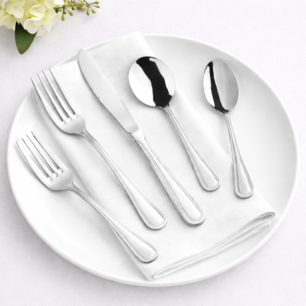 Polished+flatware+on+white+setting.png