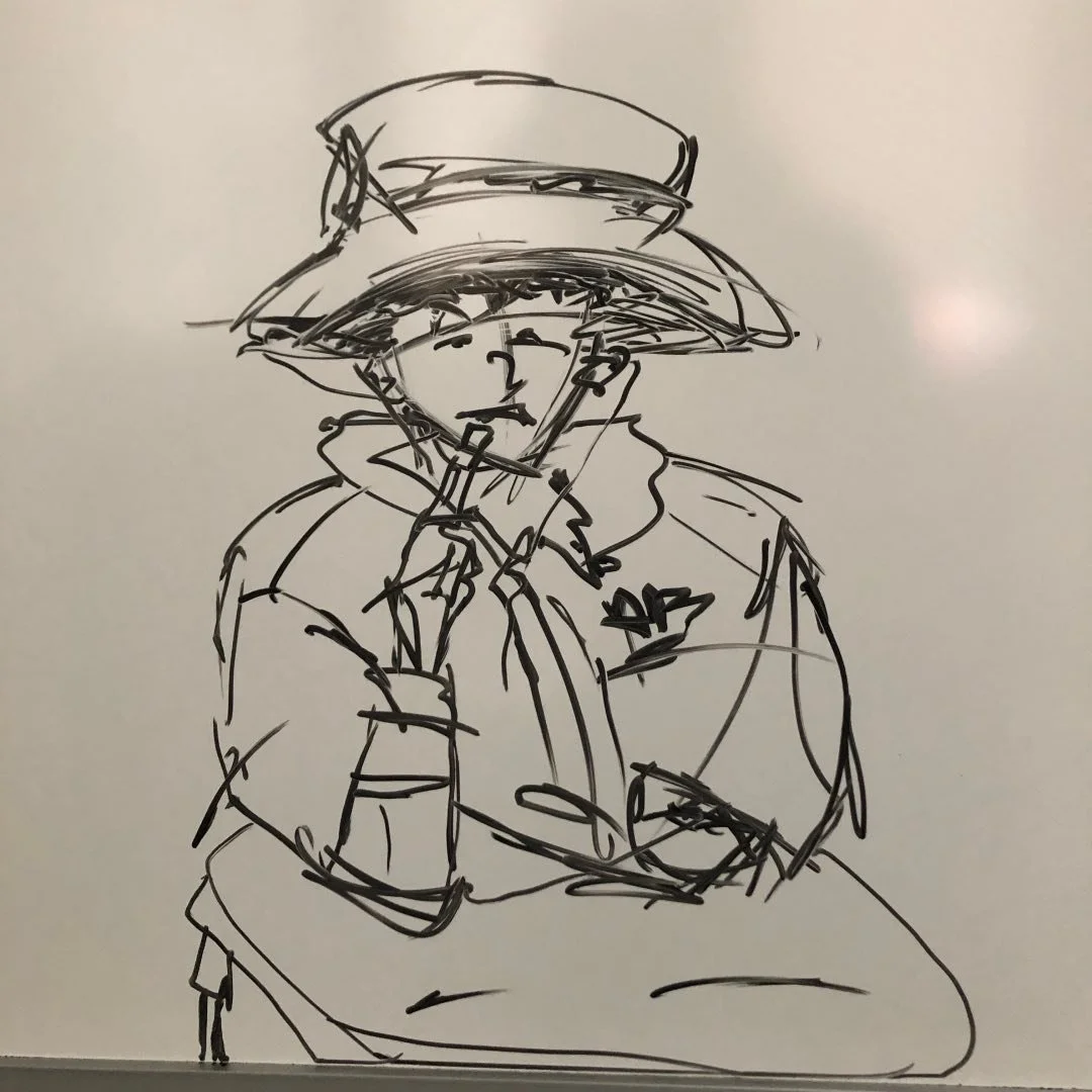 Black ink sketch of a person wearing a wide-brimmed hat, with a coat and scarf, and holding a phone to their ear.