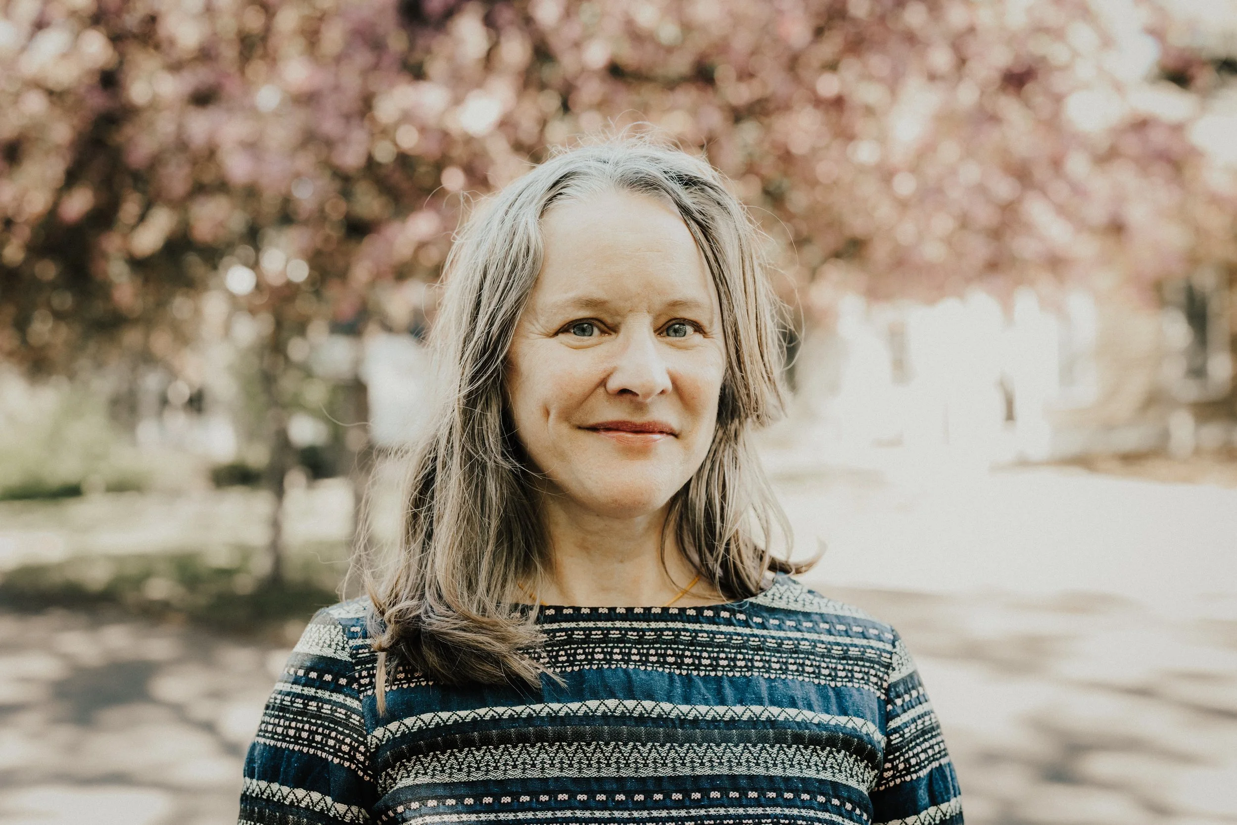 Karen Leta Gillespie, marriage & family therapist and art therapist at Resourced & Resilient, in a warm portrait photo. Click here for Karen Leta Gillespie's bio.