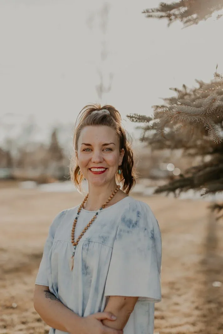Mamie Vetsch, individual therapist for adults & adolescents at Resourced & Resilient, shown smiling in a professional photo.. Click here for Mamie Vetsch's bio.