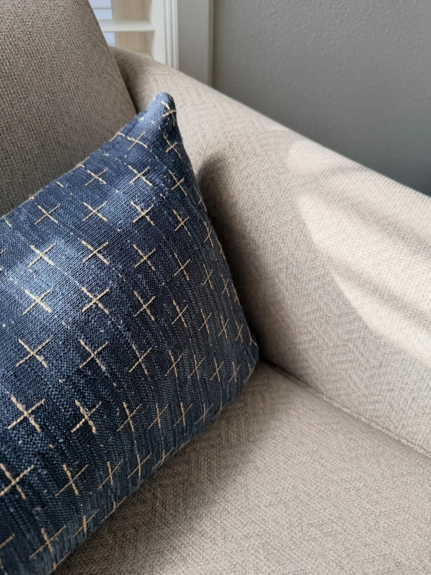 A simple space. Nothing extravagant.

A little corner of my home where I find comfort. The light dances across the fabrics, reminding me of the new mercies granted each morning.

This throw pillow has quietly stayed, through seasons of change. It off